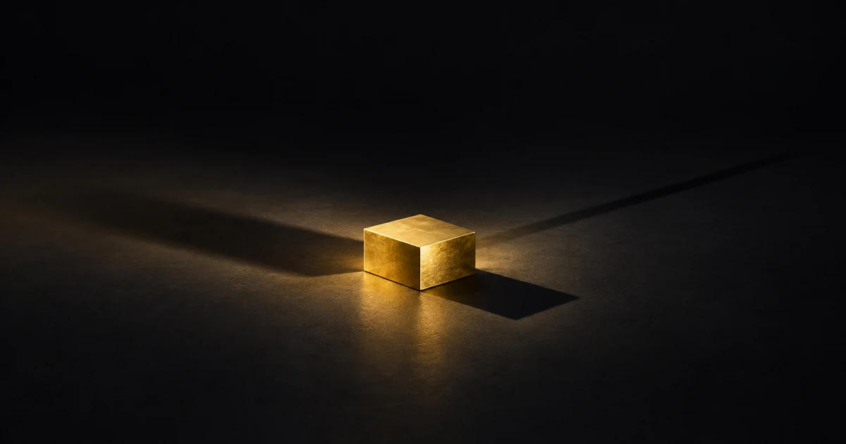 One gold block on a dark floor throwing three shadows of different length and softness