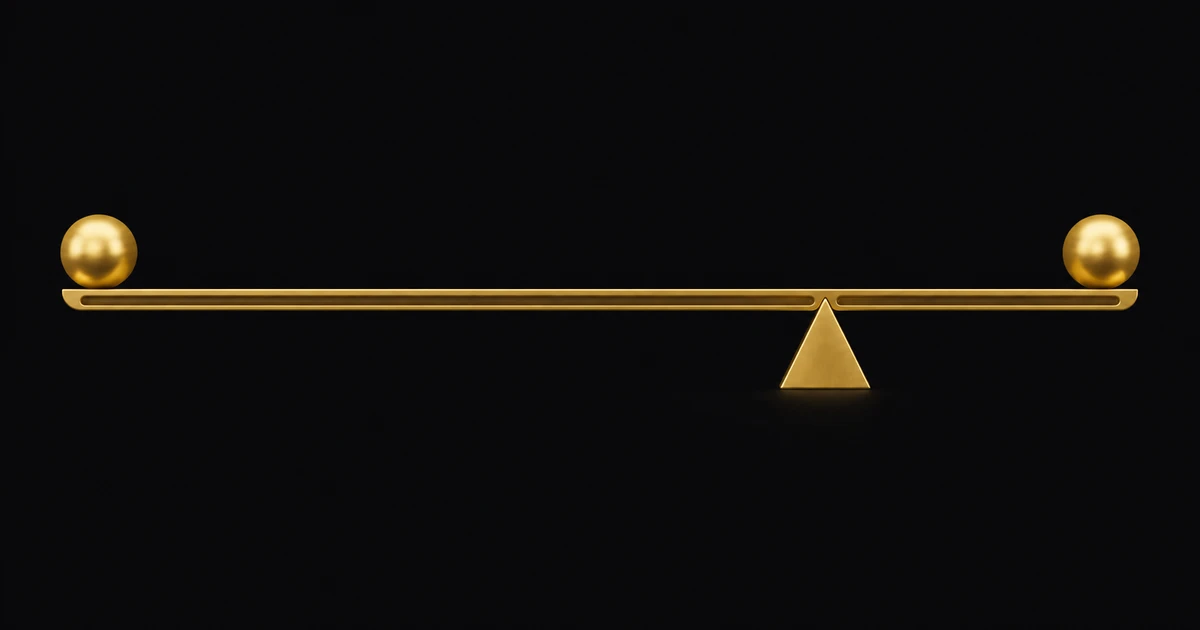 A level gold beam with matching spheres at each end, balanced on a wedge sitting off centre in a smooth groove